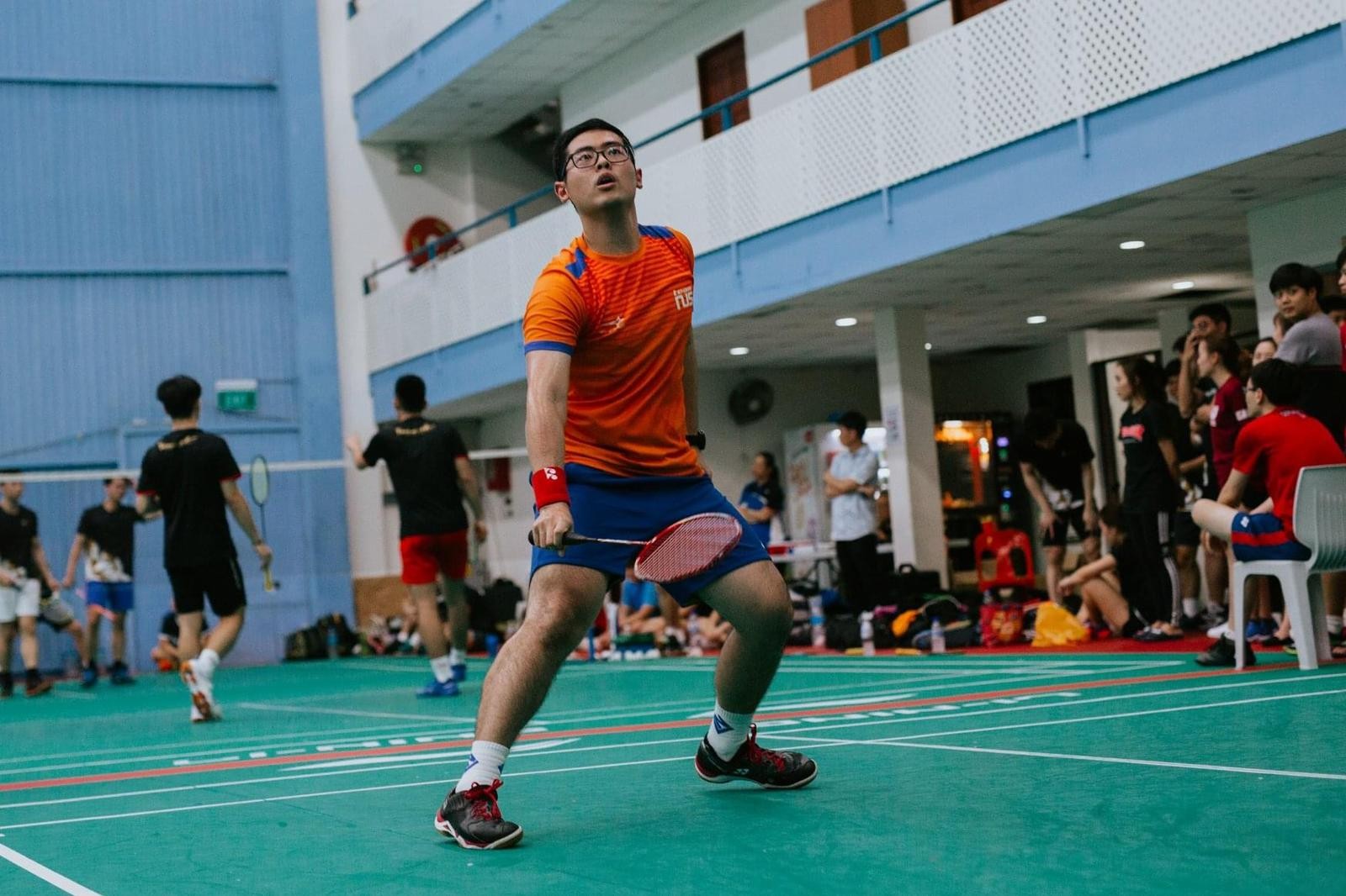 Then-undergraduate Nicholas Soh Keng Siang playing badminton for TeamNUS at the Institute-Varsity-Polytechnic Championships in January 2020. (Photo: Guo Pei)