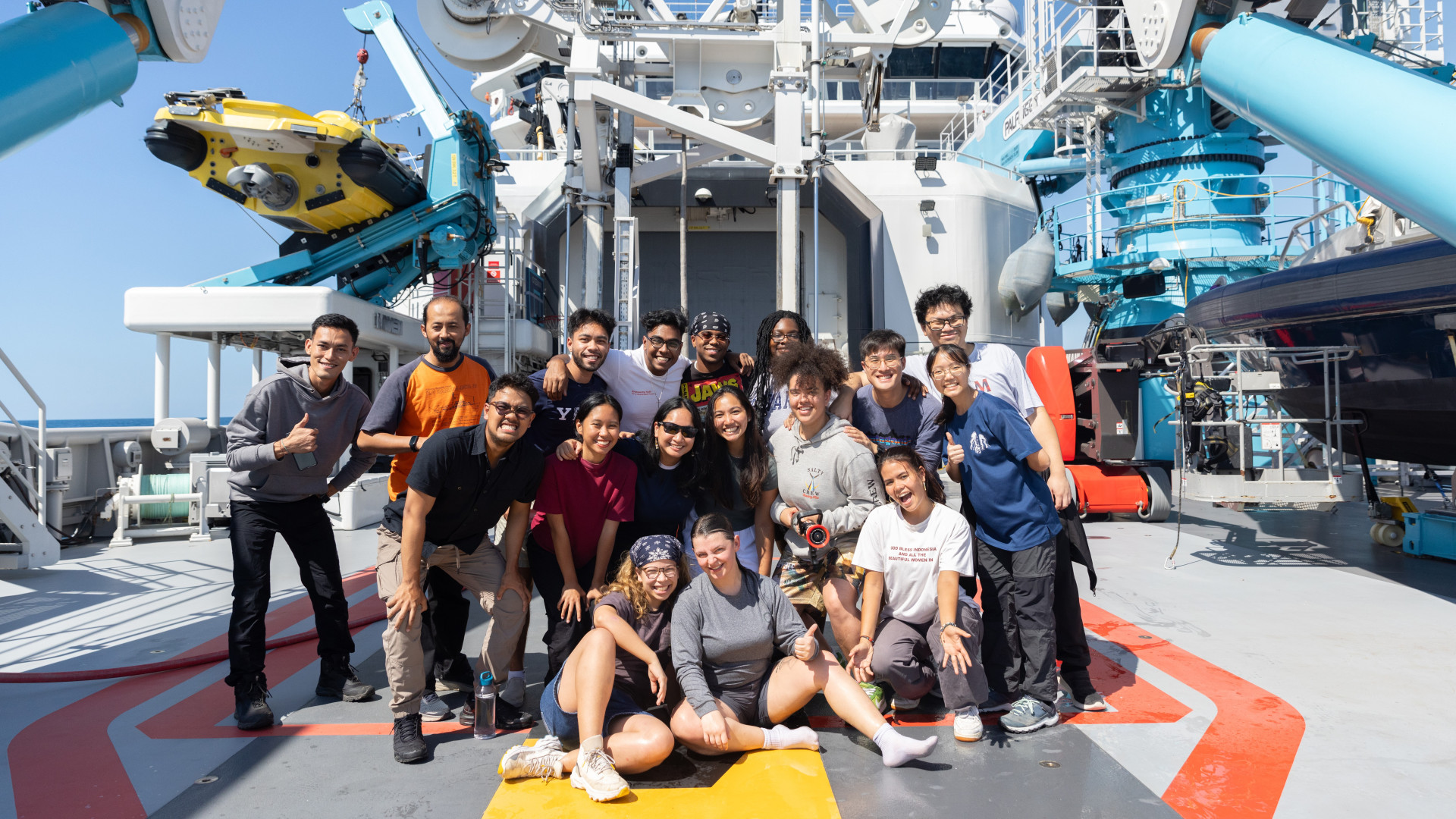 Ng Kao Jing (second row, second from the right) and Rachel Ong (second row, fourth from the left) were among 14 young explorers selected to experience and engage with the ocean on board the OceanXplorer. (Photo: OceanX)